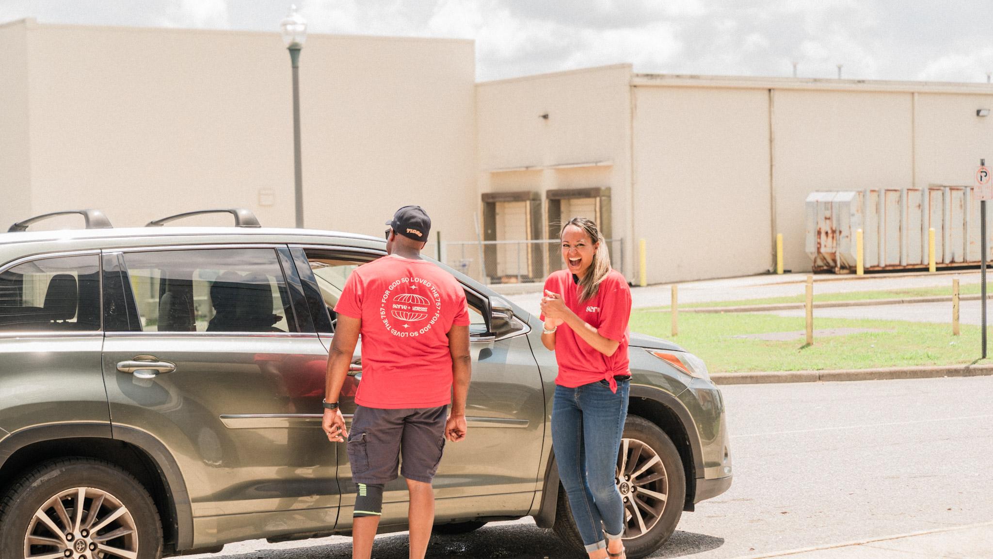Smiling Lifepoint volunteers serving together